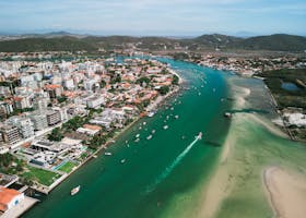 Stunning aerial shot capturing a coastal city's vibrant waterways, architecture, and scenic landscape.