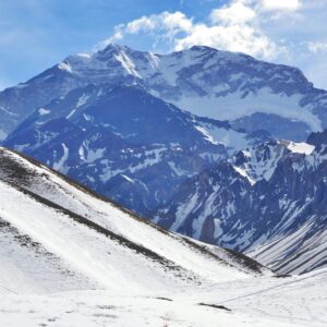 Argentina Majestic view of the snow-covered Andes Mountain peaks under a bright blue sky.